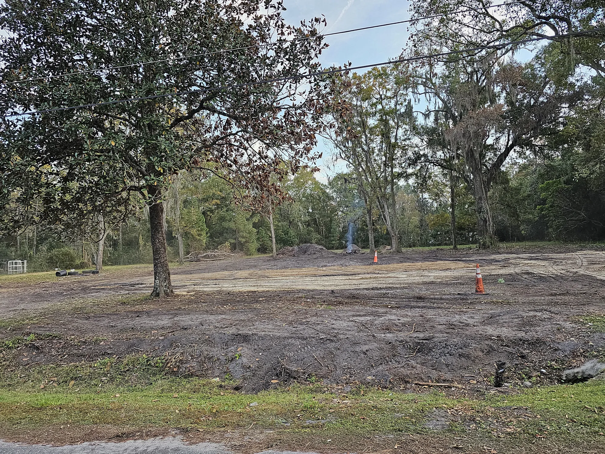 Land clearing in progress with debris removal in North Florida