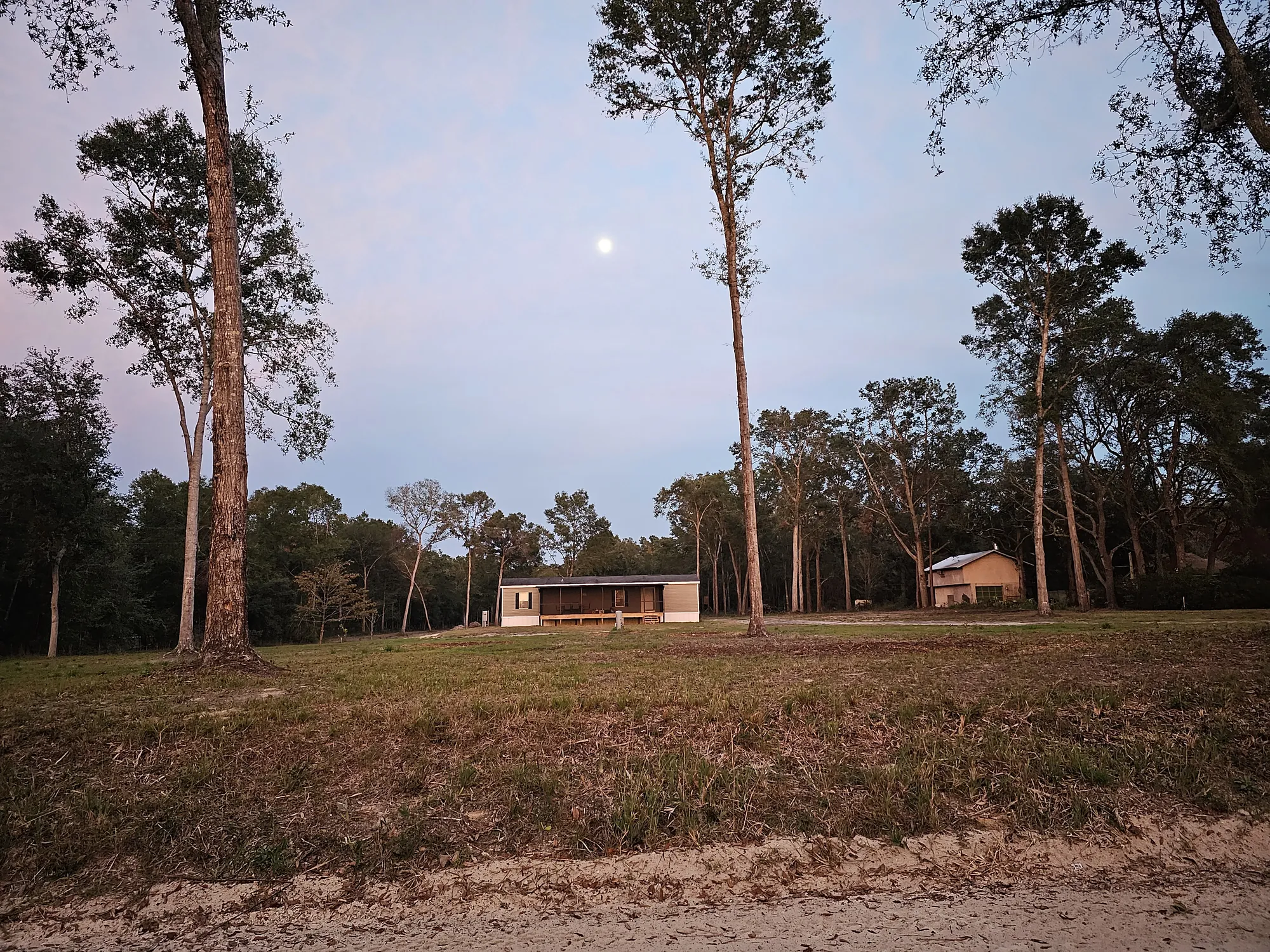 Mobile home site prep and installation on a cleared rural Florida property