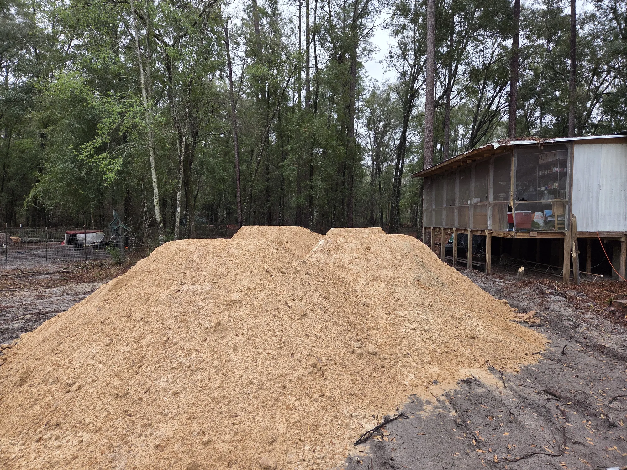 Tree and brush grinding with mulch debris from land clearing project