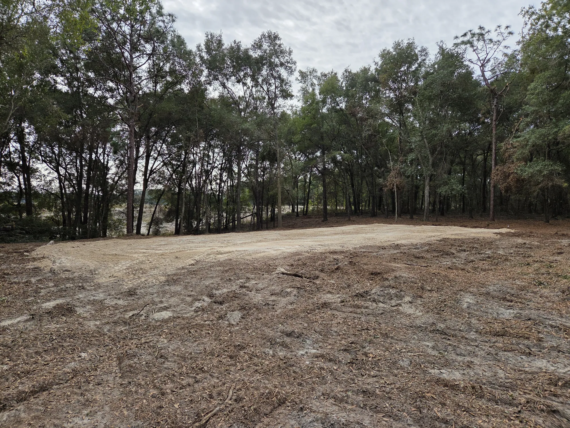 Cleared and graded dirt pad ready for construction in Lake City, FL